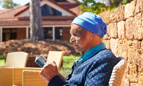 Woman reading outside at Castledare