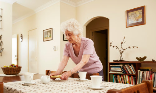 Woman setting lady Servite Retirement Village