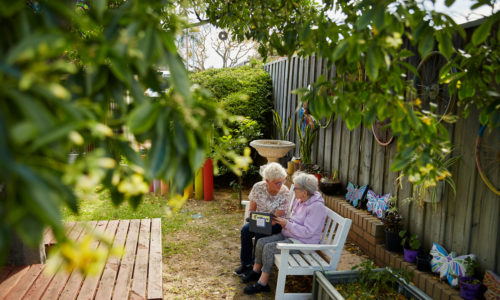 Couple talking within the gardens at Servite Retirement Village
