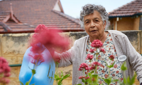 Woman gardening at Trinity Village, Duncraig