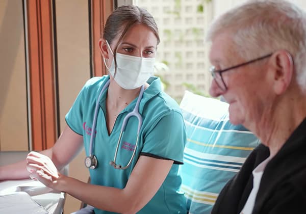 Home Care nurse assisting her client