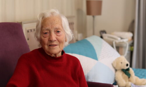 Aged care resident in her room at Castledare residential aged care