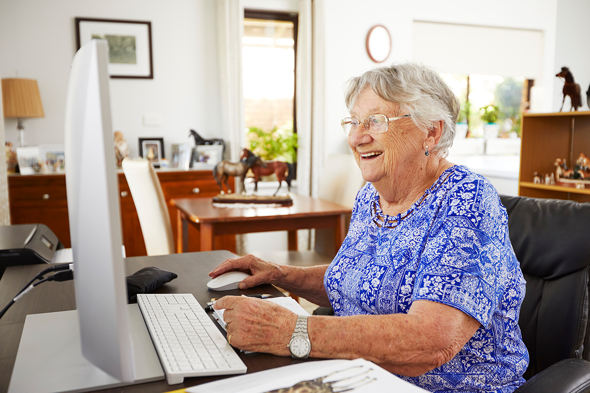 Lady on a computer at Ocean Star Independent Living Village