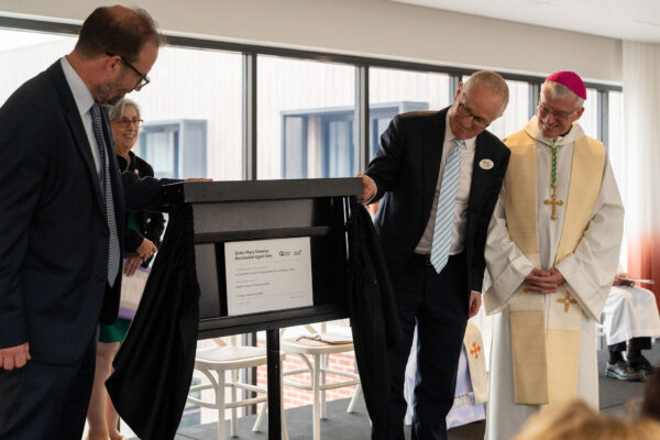 Acting CE Ben Foster, Rose Santoro, John Ogilvie and Archbishop Costello reveal the plaque to open Sr Mary Glowrey residential aged care