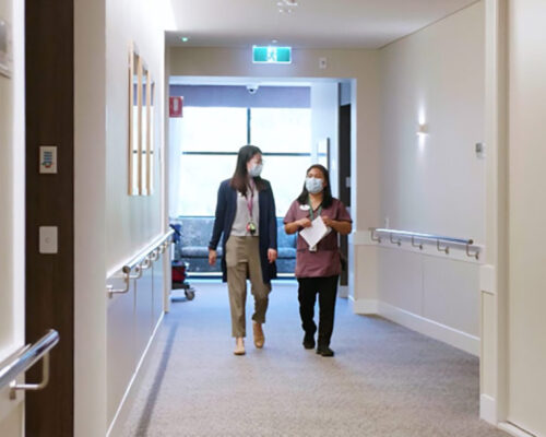 Catholic Homes Staff members walking in a corridor of an Aged Care Home