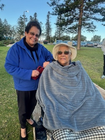 Marie and her husband share a tender sunset moment organised by St Vincent’s in Perth, highlighting compassionate elderly care.
